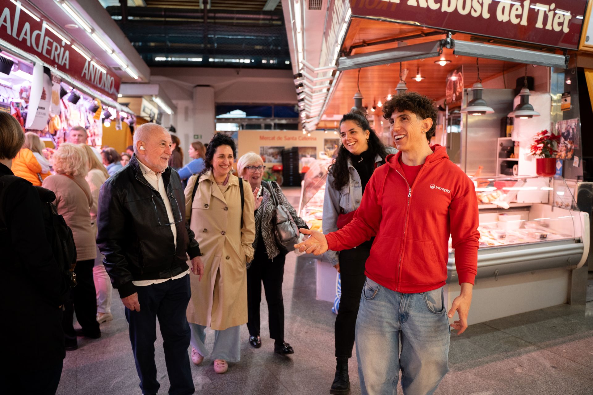 Juan in the market with a tour group
