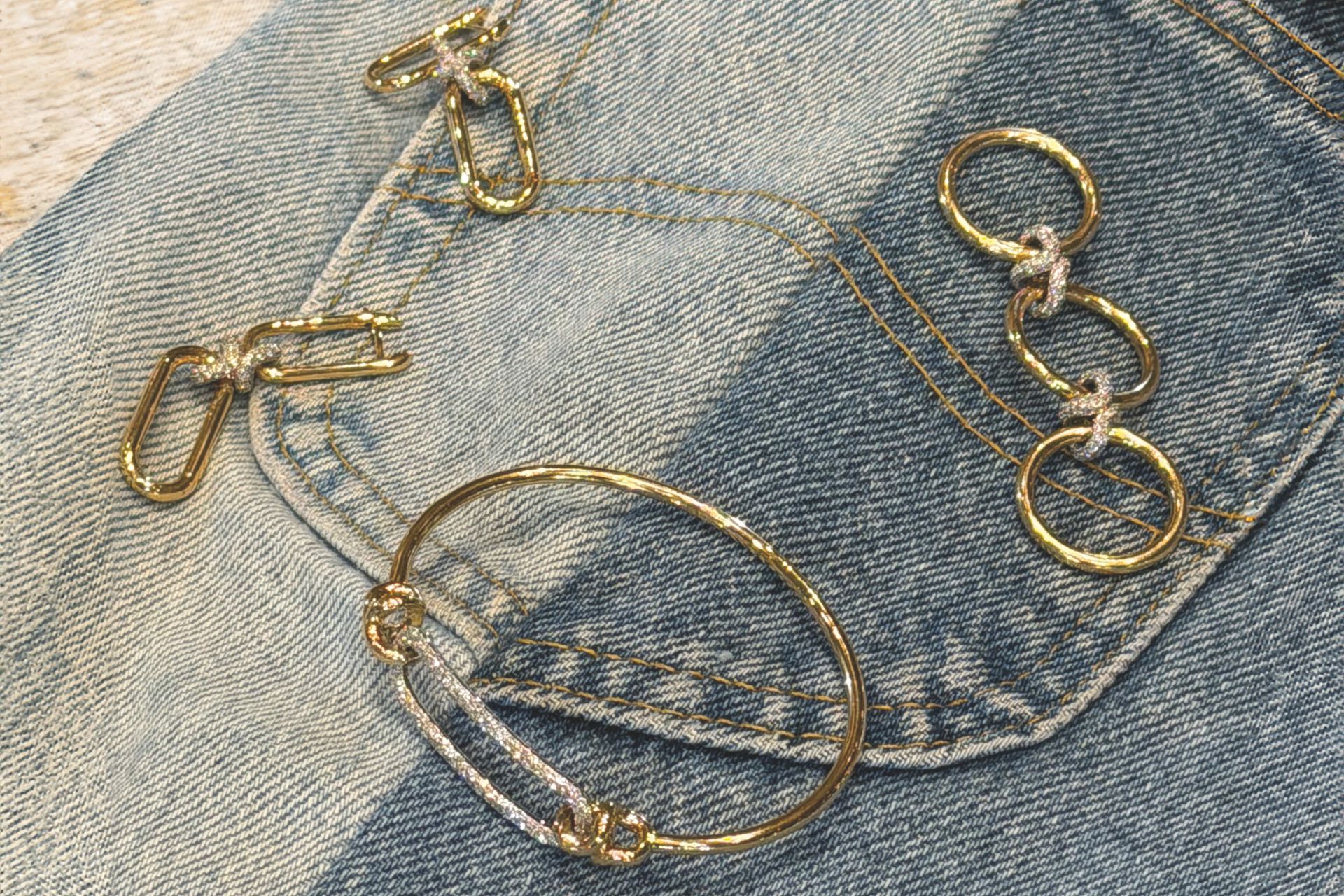 Gold jewellery on denim