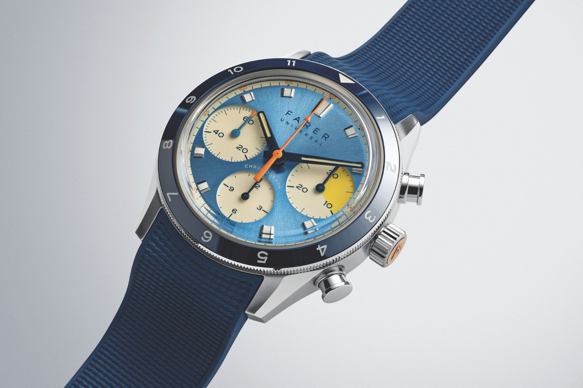 A blue watch face with a blue leather strap