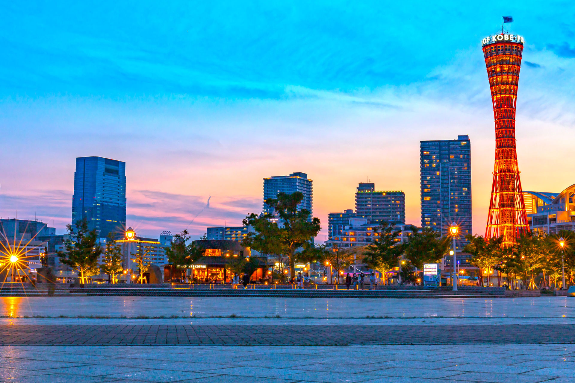 Captivating sunset view of Kobe Port Tower with vibrant cityscape in Japan