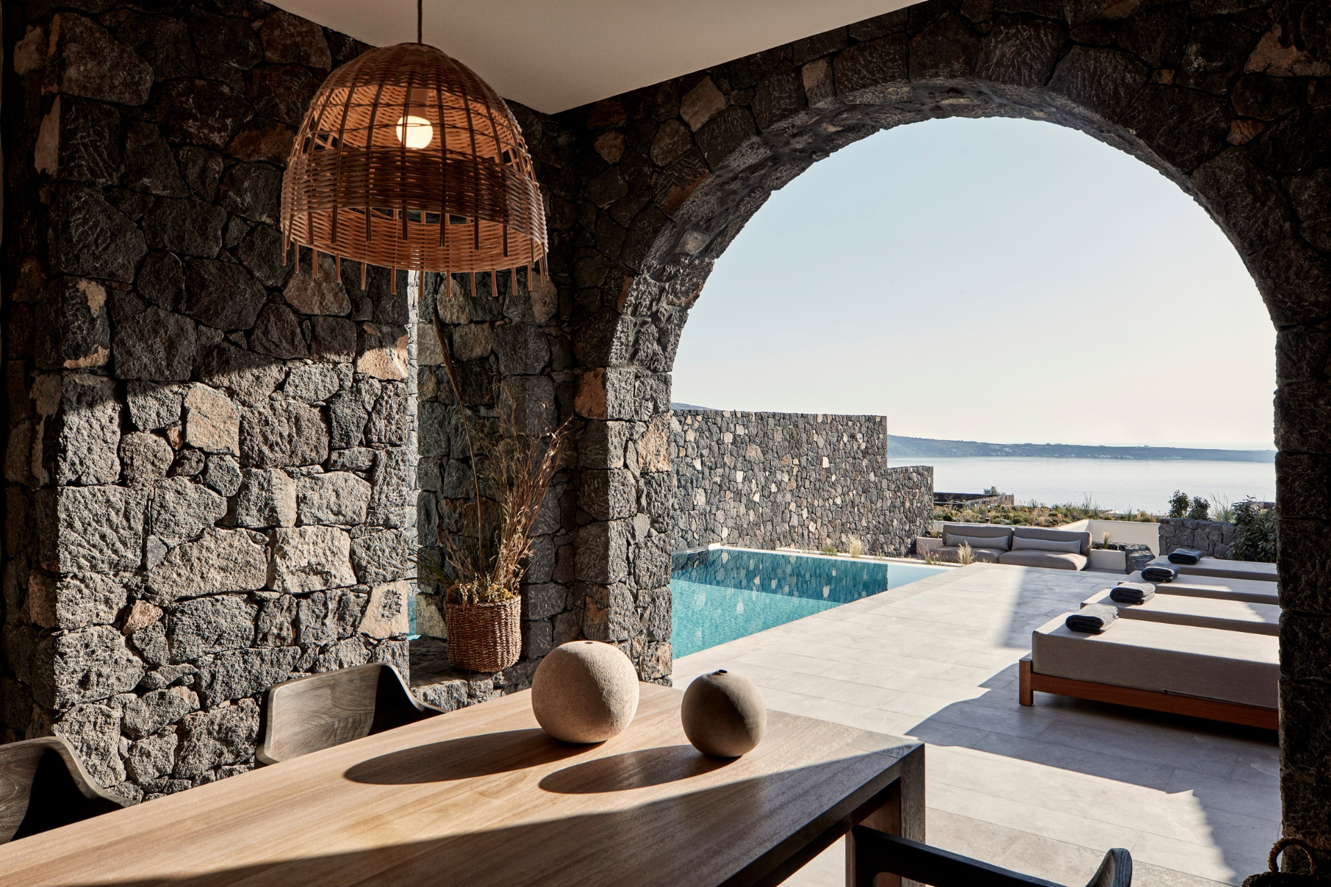 Dining table looking over the pool at Canvases Epitome