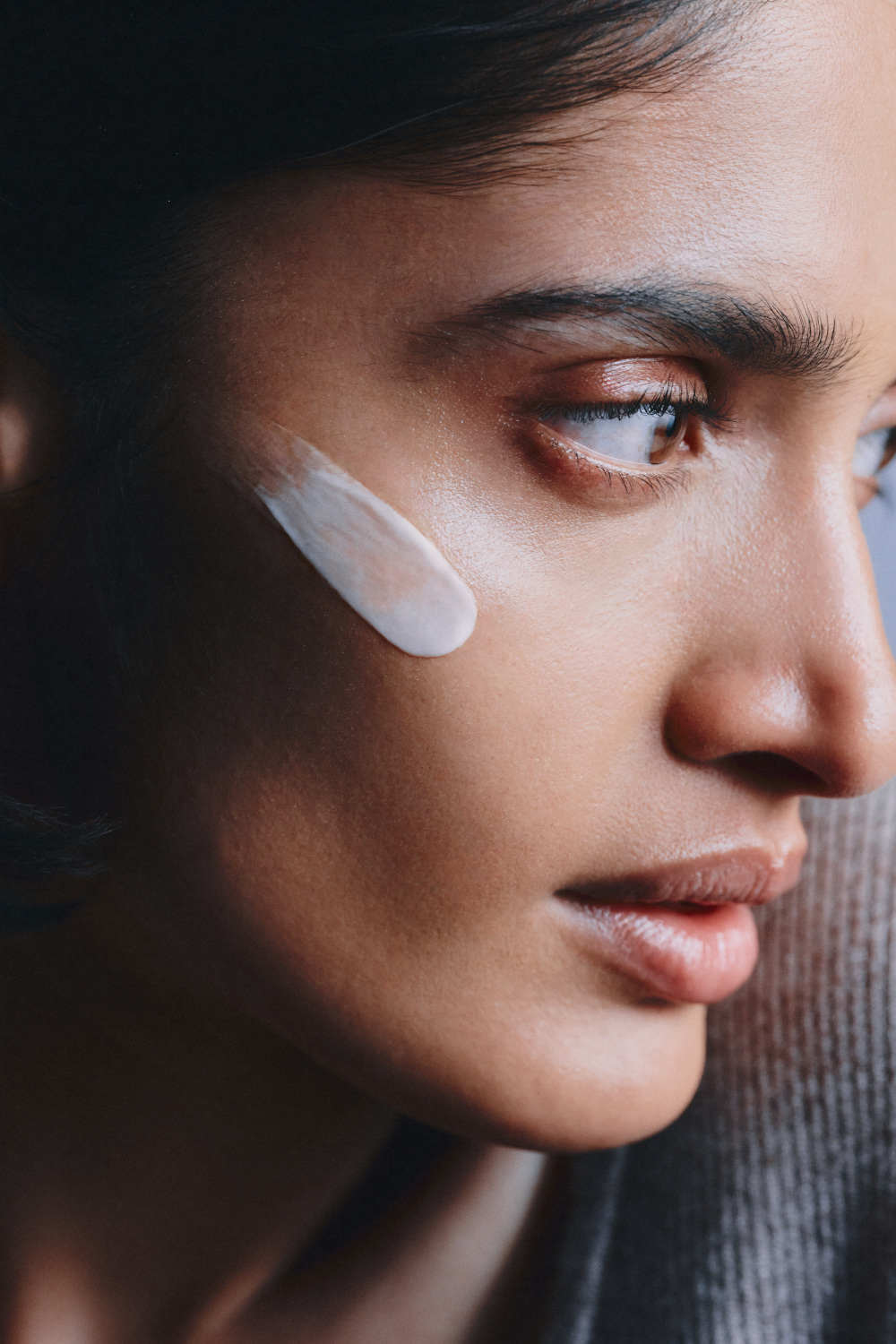 Woman with skincare cream on her face