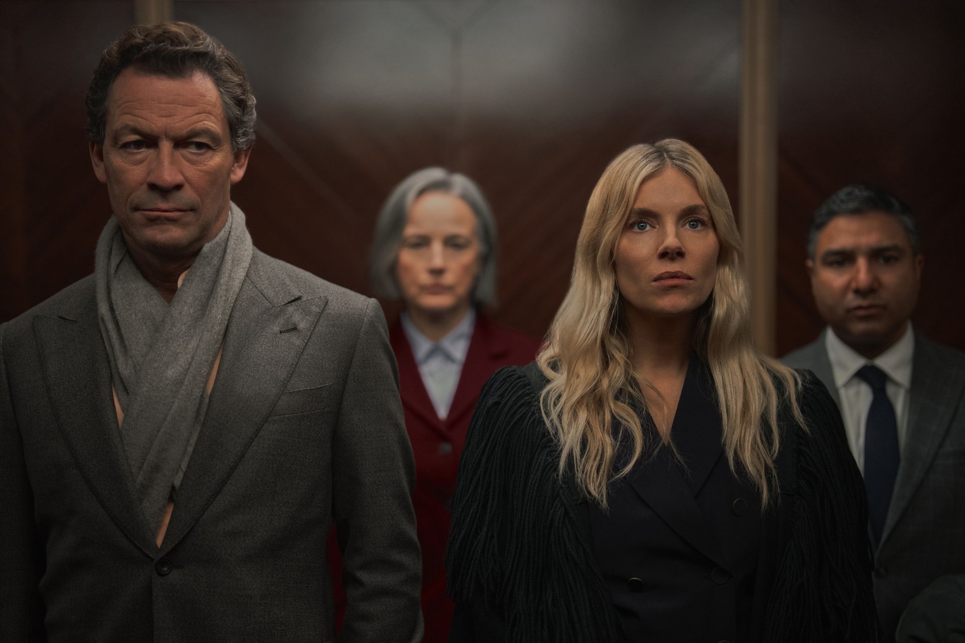 Dominic West as Morgan Henderson and Sienna Miller as Carla Duval in WAR